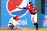 Cleveland Guardians' José Ramírez forces out Cincinnati Reds' Tommy Pham at second base and throws out Mike Moustakas at first base to complete the double play during the fourth inning of a baseball game, Thursday, May 19, 2022, in Cleveland. (AP Photo/Ron Schwane)