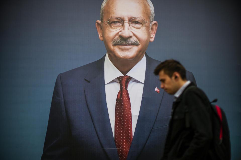 A man walks past a billboard of Turkish CHP party leader and Nation Alliance's presidential candidate Kemal Kilicdaroglu a day after the presidential election day, in Istanbul, Turkey, Monday, May 15, 2023. Turkey's presidential elections appeared to be heading toward a second-round runoff on Monday, with President Recep Tayyip Erdogan, who has ruled his country with a firm grip for 20 years, leading over his chief challenger, but falling short of the votes needed for an outright win. (AP Photo/Emrah Gurel)