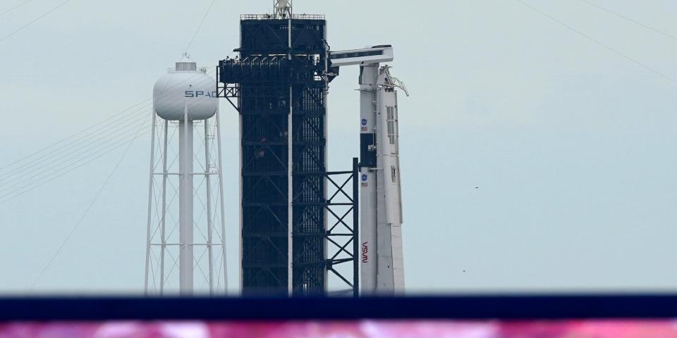 The SpaceX Falcon 9, with the Crew Dragon spacecraft on top of the rocket, sits on Launch Pad 39-A, Tuesday, May 26, 2020, at Kennedy Space Center in Cape Canaveral, Fla. Two astronauts will fly on the SpaceX Demo-2 mission to the International Space Station scheduled for launch on May 27. (AP Photo/David J. Phillip)