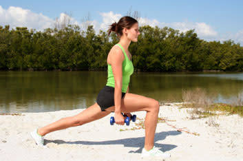 <div class="caption-credit"> Photo by: getty</div><b>Single arm row (lunge position) Works:</b> rhomboids, lats, middle back and biceps A. From a standing position, lunge forward with your right leg and hold a dumbbell in your left hand, palms facing back. Bend the torso forward by hinging at the hips while keeping your spine straight. Draw the belly button in toward the spine to protect the lower back. For added support, brace your right leg with your right hand. B. Pull the dumbbell to your ribcage, keeping the elbow at a 90-degree angle. Squeeze the shoulder blade at the top of the motion. Hold this position for 2 seconds. C. Slowly lower the weight to an extended arm position and repeat.