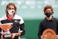 Stefanos Tsitsipas of Greece, left, poses with the trophy after defeating Andrey Rublev of Russia in the Monte Carlo Tennis Masters tournament finals in Monaco, Sunday, April 18, 2021. (AP Photo/Jean-Francois Badias)