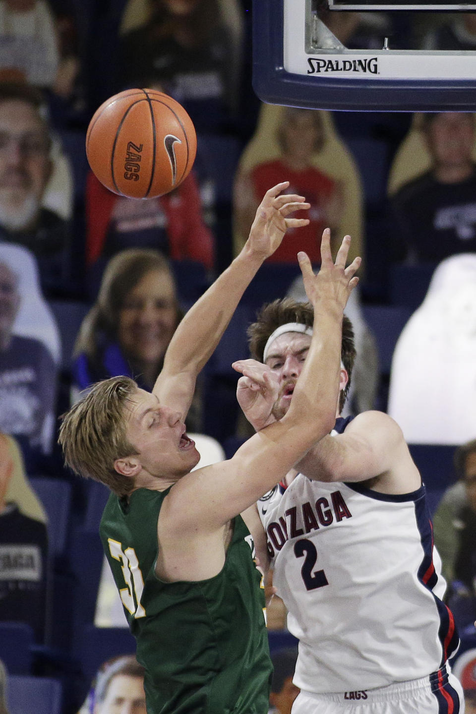 San Francisco center Jonas Visser, left, and Gonzaga forward Drew Timme go after a rebound during the first half of an NCAA college basketball game in Spokane, Wash., Saturday, Jan. 2, 2021. (AP Photo/Young Kwak)