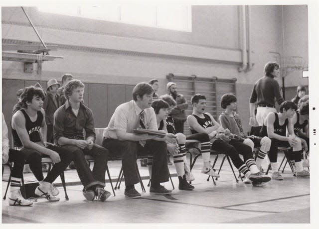 Ron Brown watches from the sideline as one of his first Whitman-Hanson High wrestling teams competes in the late 1970s. Brown, who founded the program, will be inducted into the Massachusetts Chapter of the National Wrestling Hall of Fame on Saturday.