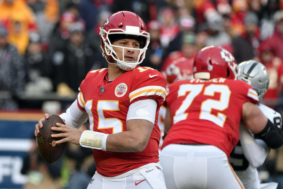 Kansas City Chiefs quarterback Patrick Mahomes (15) looks for a receiver during the first half of an NFL football game against the Oakland Raiders in Kansas City, Mo., Sunday, Dec. 30, 2018. (AP Photo/Ed Zurga)