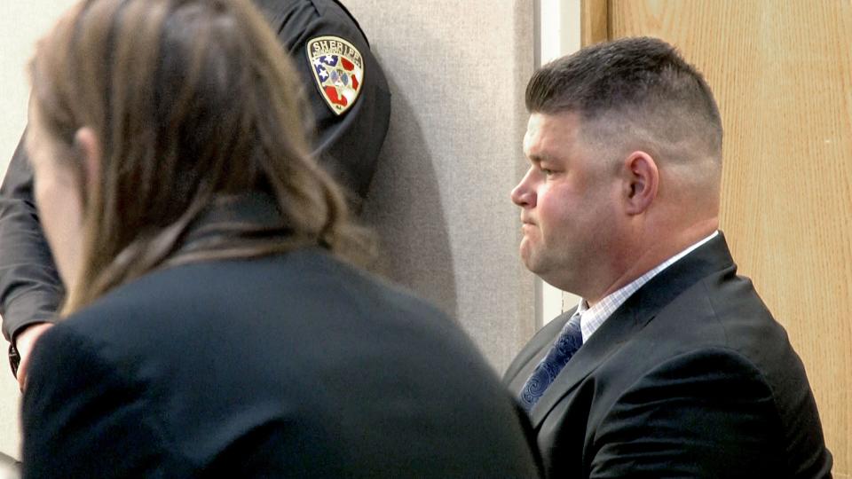 Former Wall Township Police Sergeant James Cadigan listens during his sentencing before Judge Christie L. Bevacqua at the Monmouth County Courthouse in Freehold Wednesday, March 20, 2024. Cadigan was sentenced to five years in prison for stealing about $115,000 from a local Pop Warner football club where he was a coach and from his own PBA.