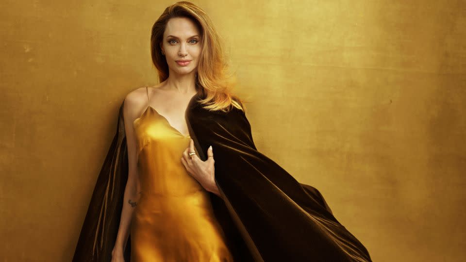 Jolie in a slip dress and velvet cape from Atelier Jolie. The actor and filmmaker worked closely with two of her children, Zahara and Pax, and the launch of the project. - Annie Leibovitz/Courtesy Vogue
