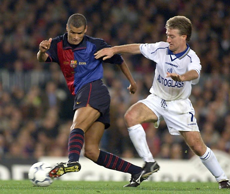 Barcelona's Rivaldo (L) keeps the ball from Didier Deschamps of Chelsea in April 2000