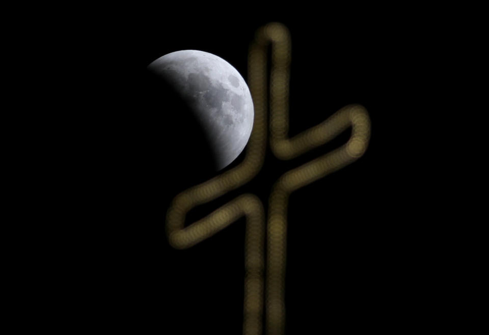 <p>A “Blood Moon” is seen during a lunar eclipse over Jerusalem, July 27, 2018. (Photo: Ammar Awad/Reuters) </p>