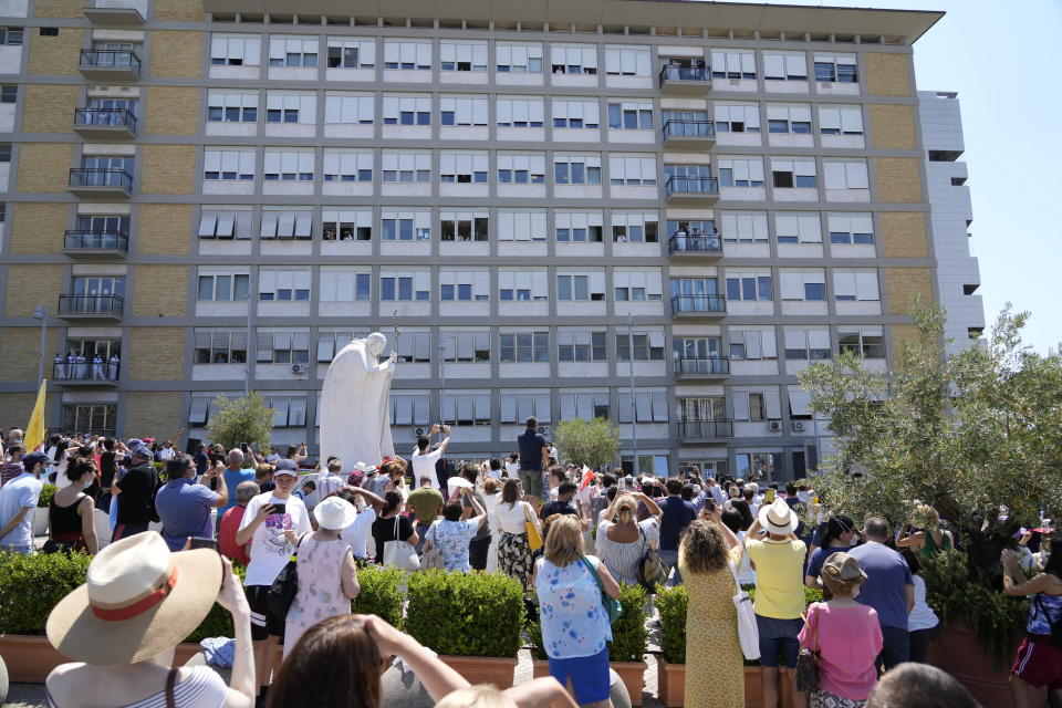 FILE -- In this Sunday, July 11, 2021 file photo, Pope Francis appears on a balcony of the Agostino Gemelli University Polyclinic in Rome, where he is recovering from intestinal surgery, for the traditional Sunday blessing and Angelus prayer. Pope Francis went to the hospital Wednesday, June 7, 2023, to undergo abdominal surgery to treat an intestinal blockage, two years after he had his colon removed 33 centimeters (13 inches) because of inflammation and narrowing of the large intestine. (AP Photo/Gregorio Borgia)