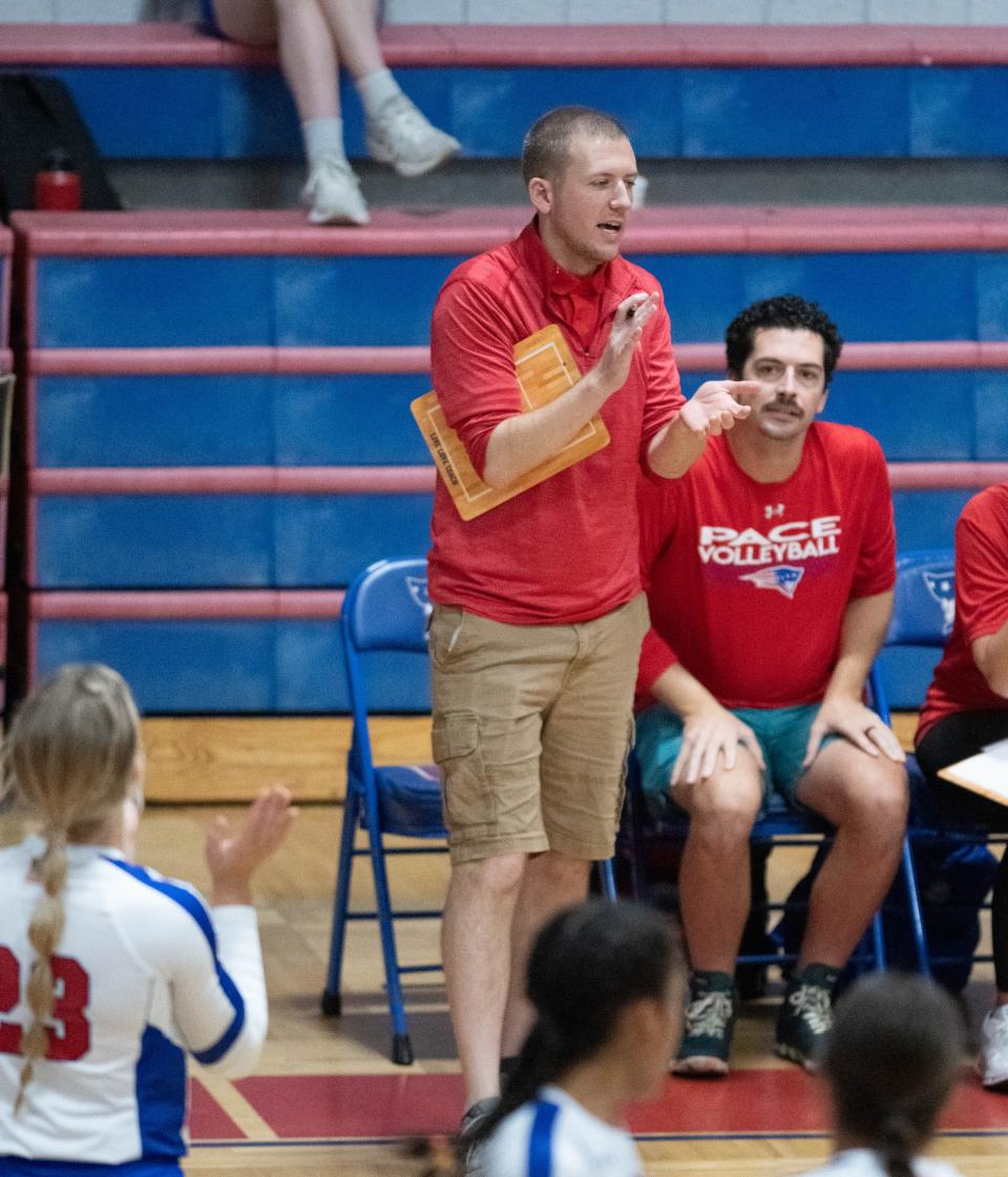 Patriots head coach Cody Trimm cheers on his players during the West Florida vs Pace volleyball match at Pace High School on Wednesday, Sept. 6, 2023.