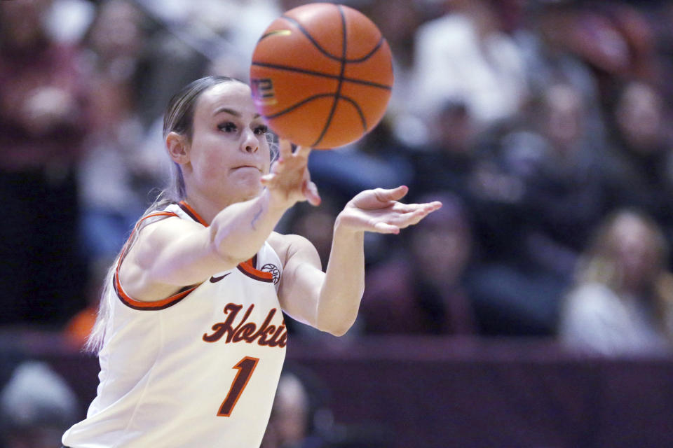 Virginia Tech's Carleigh Wenzel (1) attempts a pass that was intercepted by a Clemson defender in the first half of an NCAA college basketball game in Blacksburg, Va, Sunday, Jan. 21, 2024. (Matt Gentry/The Roanoke Times via AP)