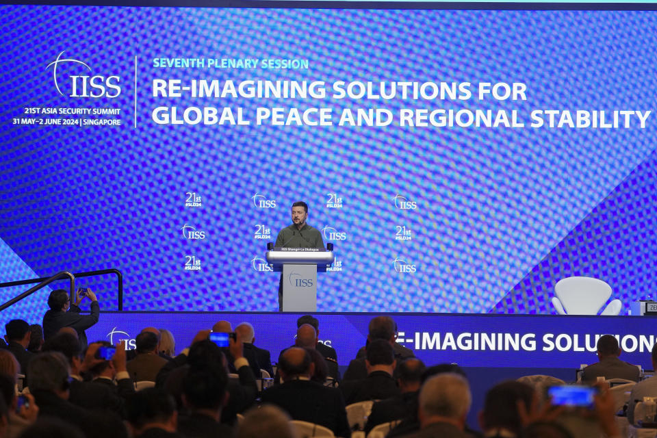 Ukraine's President Volodymyr Zelenskyy delivers his speech during the 21st Shangri-La Dialogue summit at the Shangri-La Hotel in Singapore, Sunday, June 2, 2024. (AP Photo/Vincent Thian)