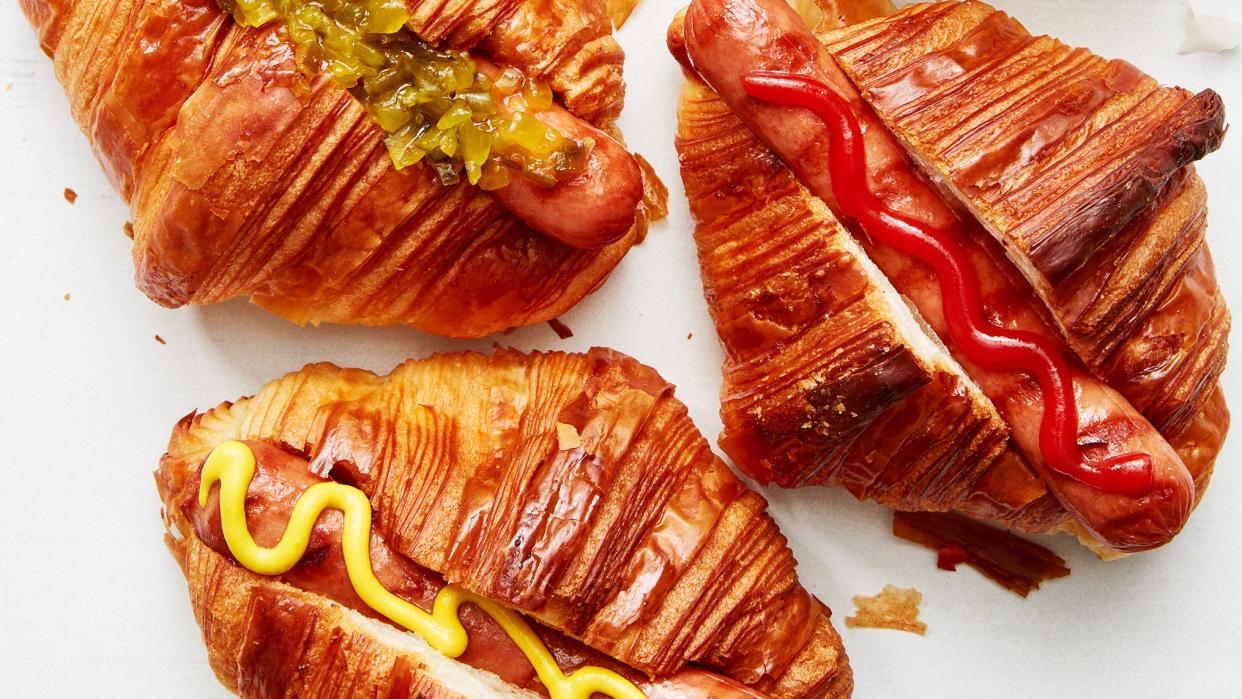 hot dogs in croissants with toppings