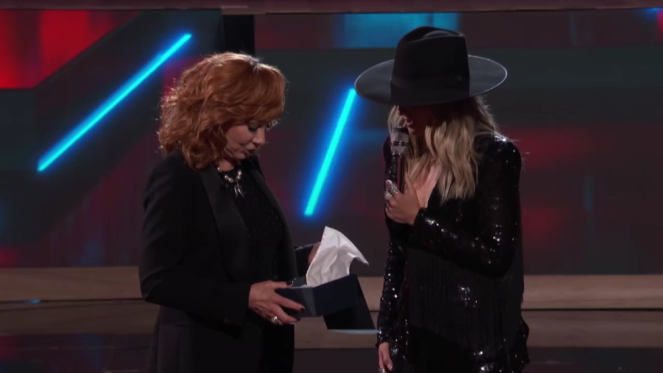 Reba McEntire invites Lainey Wilson to be the latest member of the Grand Ole Opry cast on "The Voice"'s Season 25 finale.