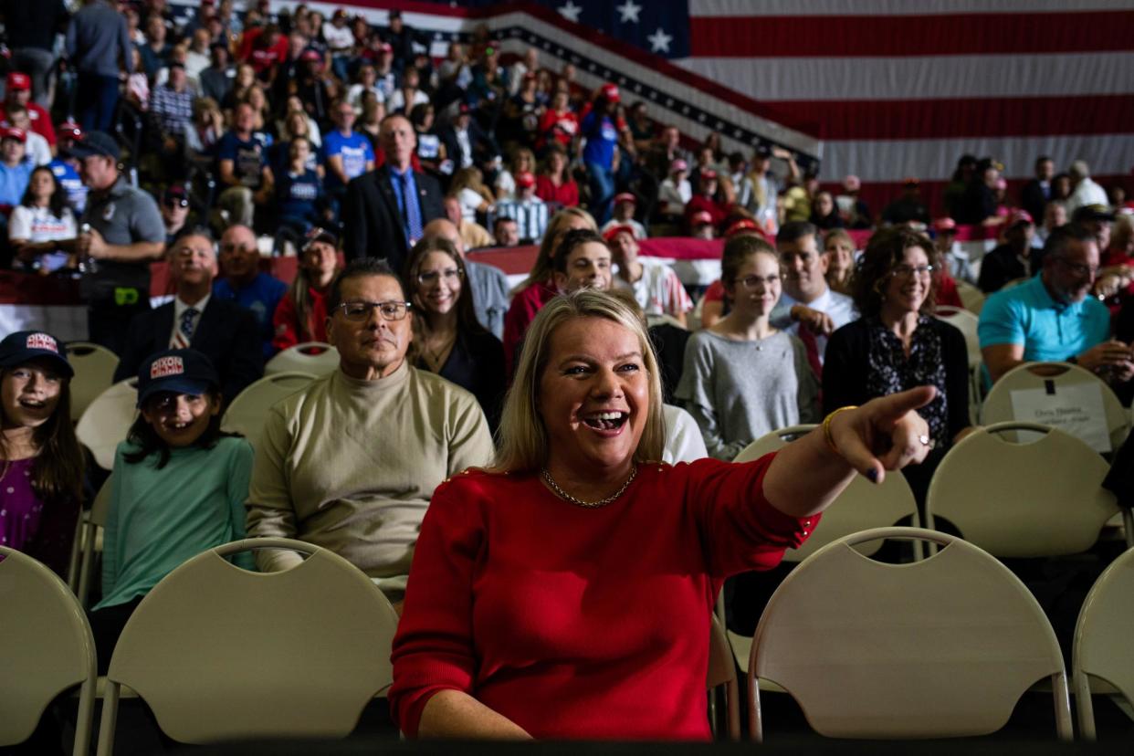 <span>Meshawn Maddock, center, attends a Trump rally in Warren, Michigan, on 1 October 2022.</span><span>Photograph: Emily Elconin/Getty Images</span>