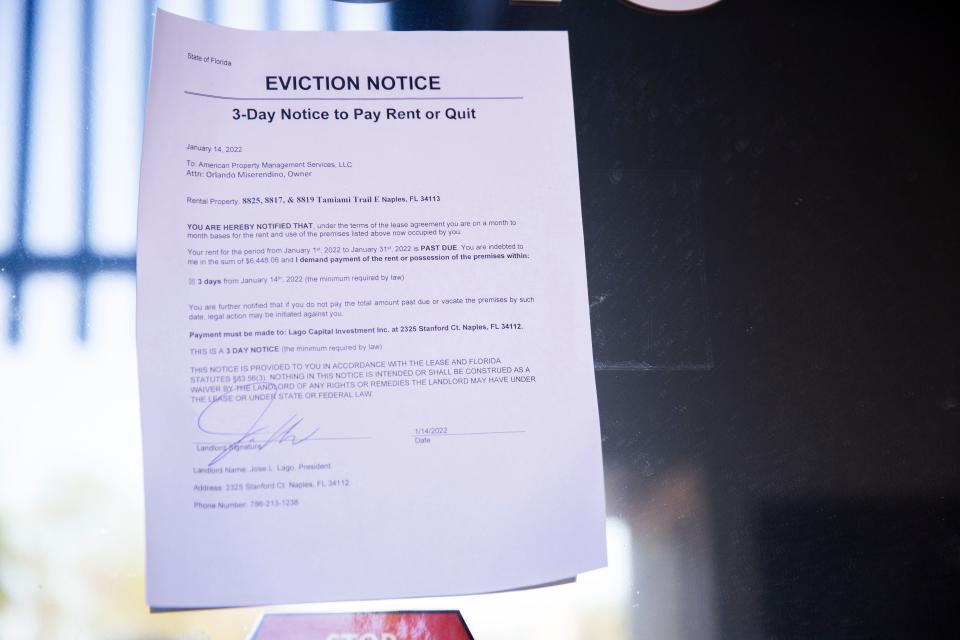 An eviction notice on the front door of American Property Management Services, LLC on Tuesday, Jan. 18, 2022, in Naples, Fla.