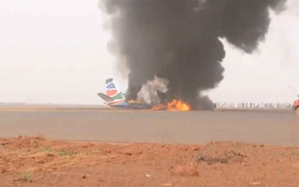 Plane wreckage on fire - Credit: ITN