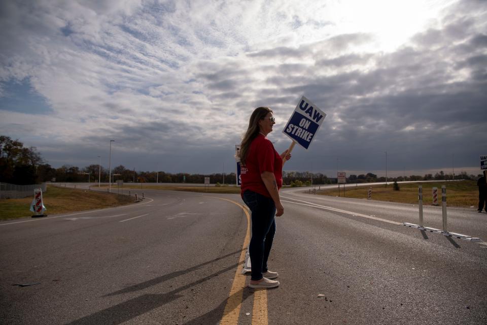 Sherry Barger pickets with other workers near the General Motors plant in Spring Hill on Oct. 29 after United Auto Workers Local 1853 announced a strike.