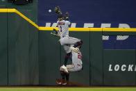 Minnesota Twins left fielder Nick Gordon (1) is unable to reach a flyout by Texas Rangers' Marcus Semien that center fielder Byron Buxton (25) then caught in the fourth inning of a baseball game, Friday, July 8, 2022, in Arlington, Texas. (AP Photo/Tony Gutierrez)