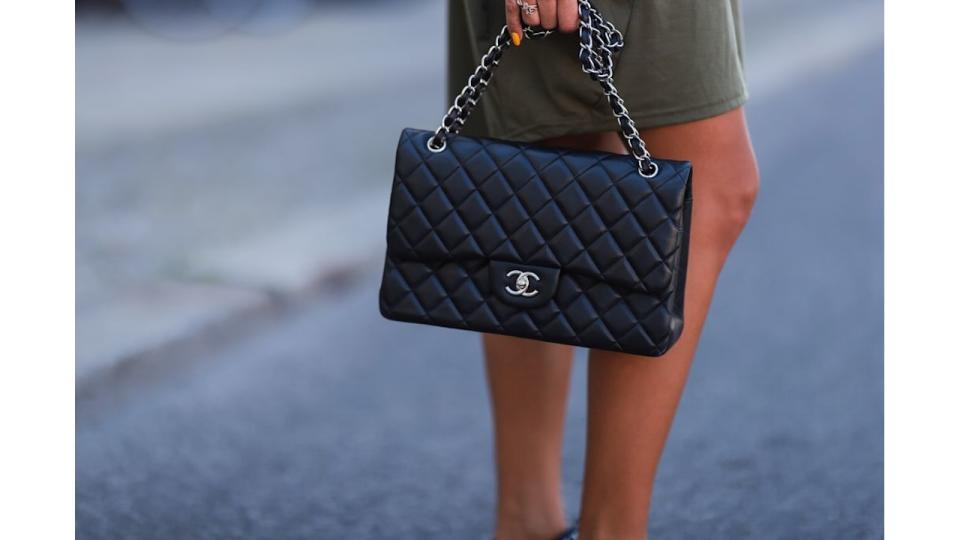 Nina Suess wearing black Chanel leather flap bag and khaki Zara dress on June 16, 2021 in Berlin, Germany. (Photo by Jeremy Moeller/Getty Images)