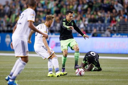 Oct 4, 2015; Seattle, WA, USA; Seattle Sounders FC midfielder Marco Pappa (10) dribbles the ball against the Los Angeles Galaxy during the second half at CenturyLink Field. Los Angeles tied Seattle, 1-1. Joe Nicholson-USA TODAY Sports