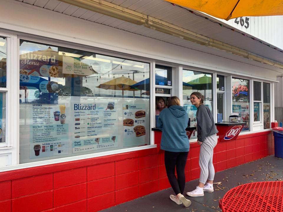 Merritt Island Dairy Queen customers place their order at the window Friday afternoon.