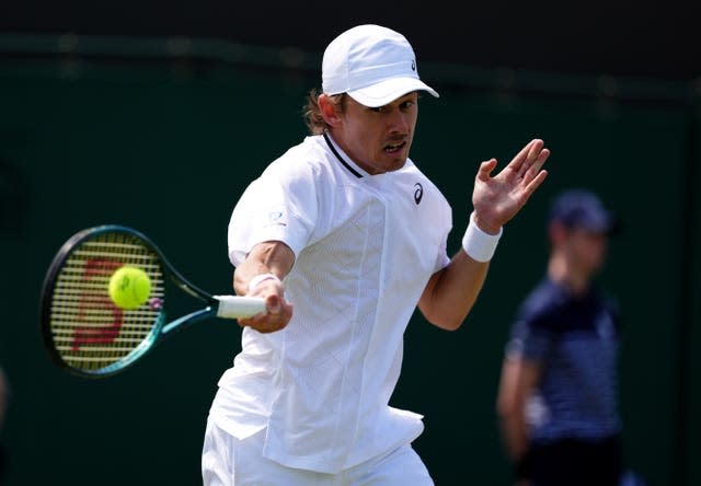 Alex De Minaur hits a forehand