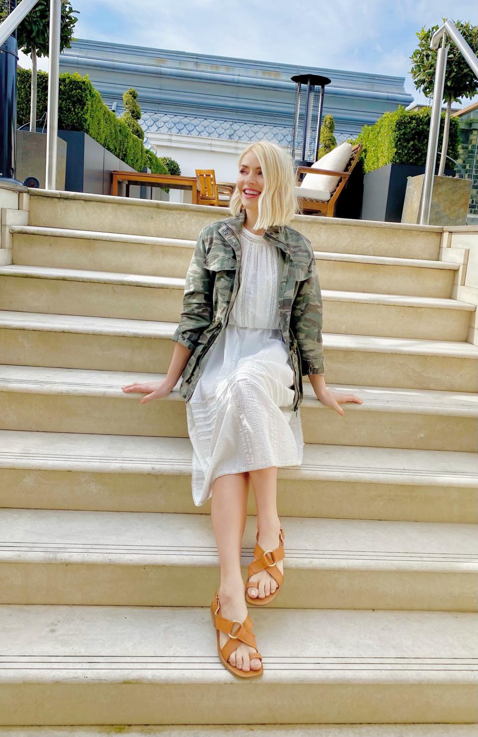 Holly Willoughby styles M&S' Pure Cotton Lace Trim Waisted Dress with a camouflage jacket and sandals for her first post-lockdown look.  (Marks and Spencer)