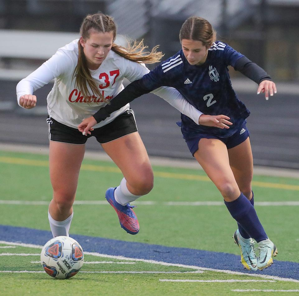 Chardon's Julia Seibert, left, and Twinsburg's Bree Banach battle for possession in a Division I sectional tournament game on Thursday, Oct. 20, 2022 in Twinsburg.