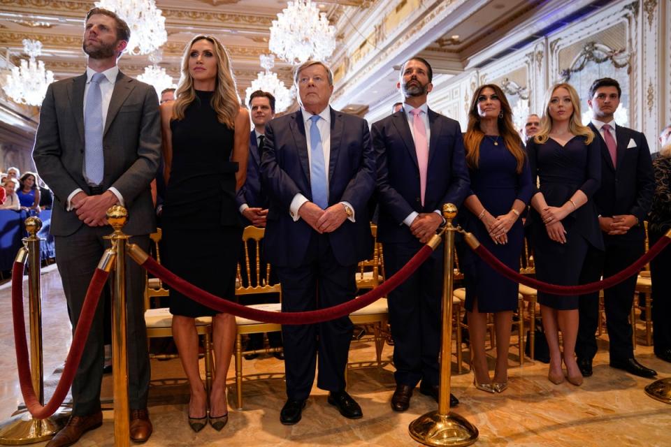 From left, Eric Trump and his wife Lara, Victor Knavs, Donald Trump Jr, and his fiancee Kimberly Guilfoyle, and Tiffany Trump and her husband Michael Boulos, listen as former President Donald Trump speaks at his Mar-a-Lago estate Tuesday, April 4, 2023, in Palm Beach, after being arraigned earlier in the day in New York City. (AP)
