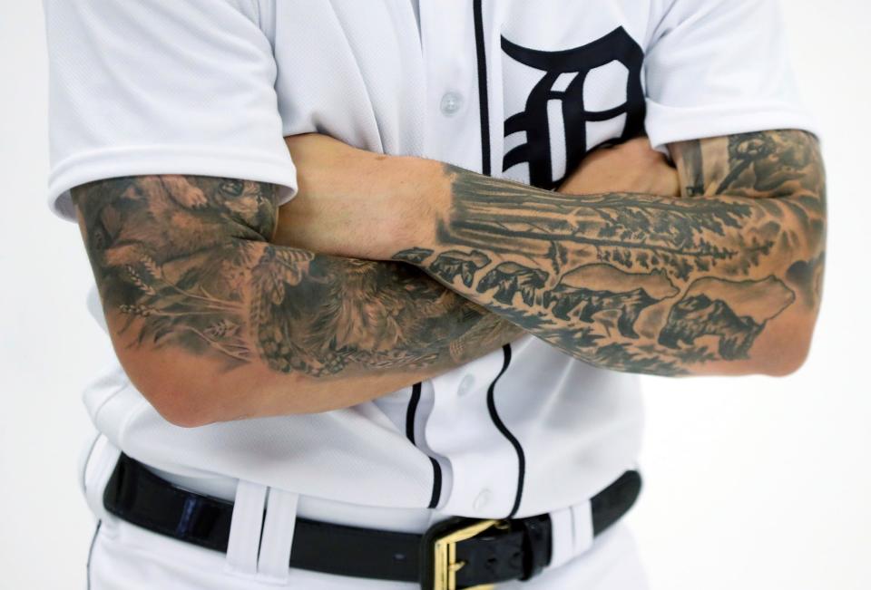 Detroit Tigers catcher Eric Haase poses during picture day at spring training Feb. 19, 2023. He loves the outdoors and bears; one of the tattoos on his arm represent a momma and father bear with the cubs walking behind them. "That's my wife and kids, you don't mess with mom and cubs."