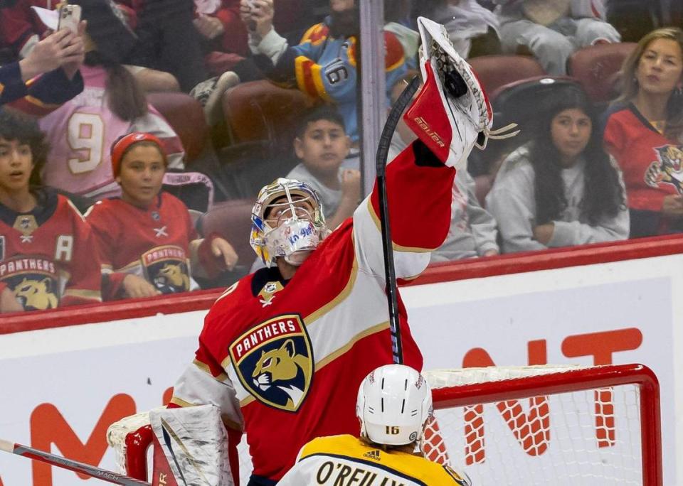 Florida Panthers goalie Spencer Knight (30) blocks a shot by the Nashville Predators in the second period of an NHL preseason game at the Amerant Bank Arena on Monday, Sept. 25, 2023, in Sunrise, Fla.