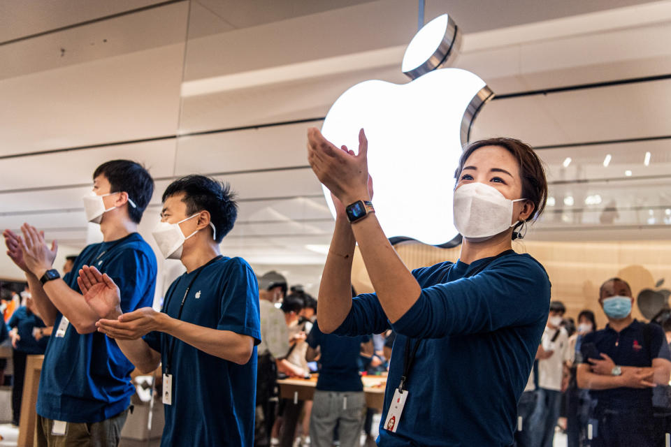 WUHAN, CHINA - 2022/05/21: Apple staff wearing masks welcome customers at the opening of a new store in Wuhan, China's Hubei province. Apple opened its first flagship store in Wuhan, also the 54th flagship store in Greater China. (Photo by Ren Yong/SOPA Images/LightRocket via Getty Images)