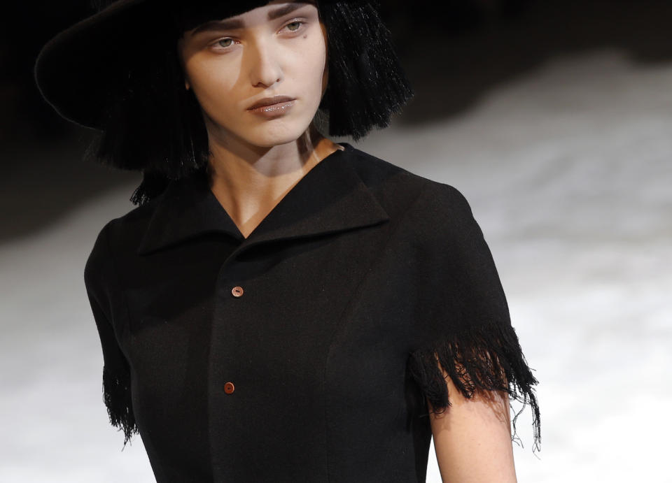 A model wears a creation by Japanese fashion designer Yohji Yamamoto for his Fall/Winter 2013-2014 ready to wear collection, in Paris, Friday, March 1, 2013. (AP Photo/Christophe Ena)