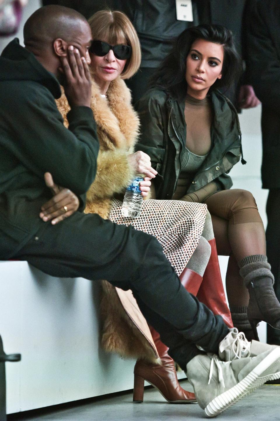 Let me hear: Kim tries to listen in as Anna Wintour and Kanye West chat on the FROW (AP Photo/Bebeto Matthews) (AP Photo/Bebeto Matthews)