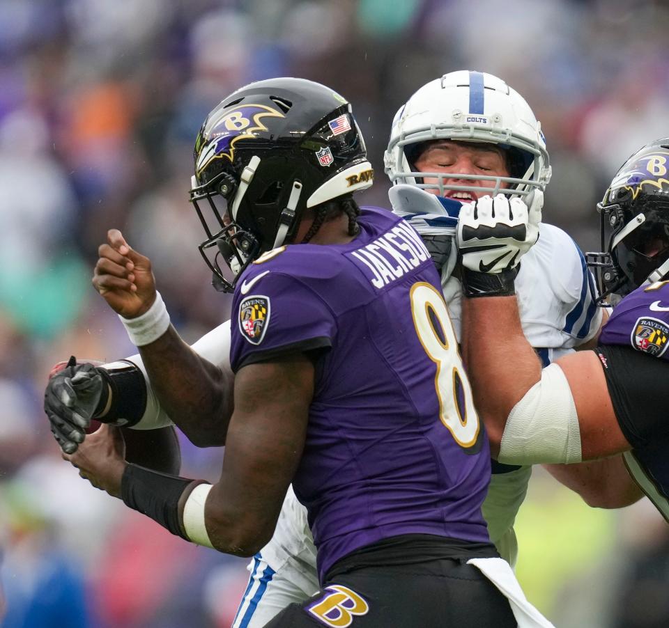 Indianapolis Colts defensive tackle Taven Bryan (96) forces a fumble by bumping the ball out of the hand of Baltimore Ravens quarterback Lamar Jackson (8) that was recovered by Indianapolis Colts defensive end Kwity Paye (51) on Sunday, Sept. 24, 2023, at M&T Bank Stadium in Baltimore.