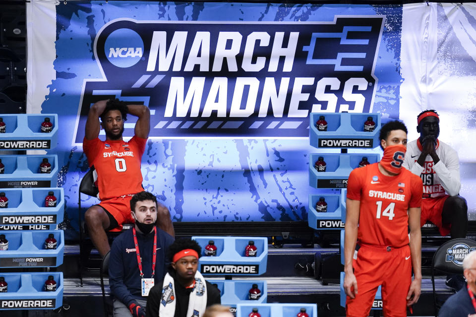 Syracuse forward Alan Griffin (0) and Jesse Edwards (14) watch from the bench against Houston in the second half of a Sweet 16 game in the NCAA men's college basketball tournament at Hinkle Fieldhouse in Indianapolis, Saturday, March 27, 2021. Houston won 62-46. (AP Photo/Michael Conroy)