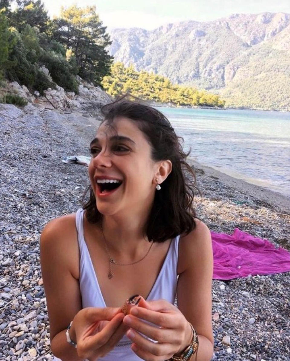 Pinar Gultekin, 27, on a beach before her murder. 