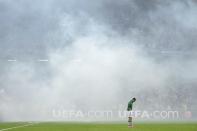 TOPSHOTS Irish midfielder Aiden McGeady is engulfed in smoke from a flare during the Ireland against Croatia game at the Euro 2012 football championships on June 10, 2012 at the Municipal Stadium in Poznan. AFP PHOTO / FABRICE COFFRINIFABRICE COFFRINI/AFP/GettyImages