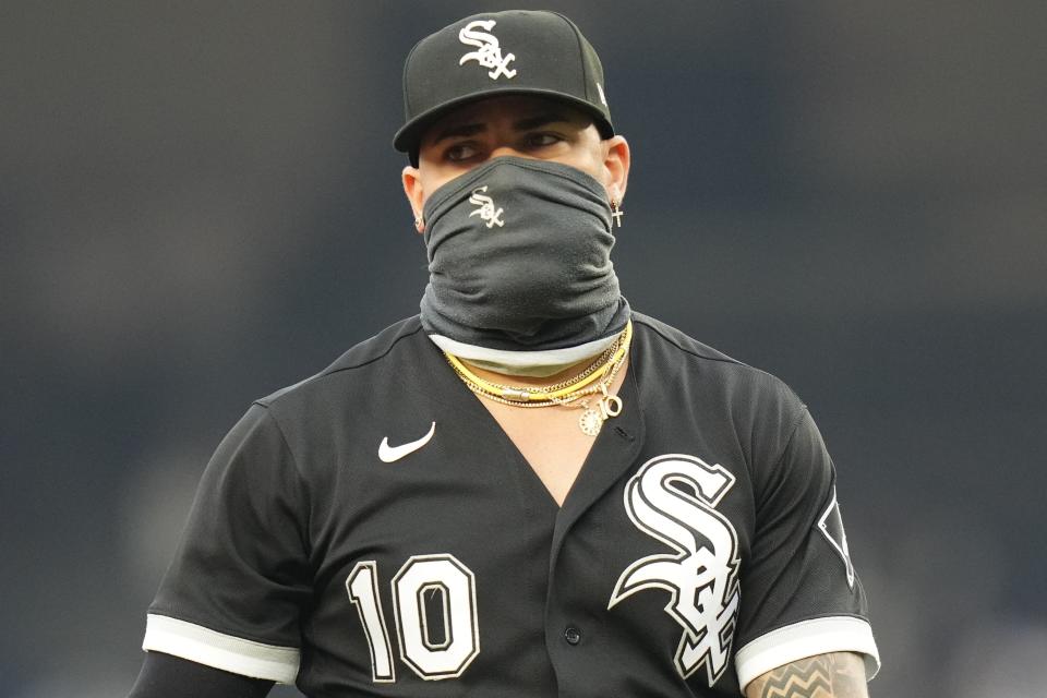 Chicago White Sox third baseman Yoan Moncada (10) wears a face covering as he takes the field during the first inning in the first baseball game of a doubleheader against the New York Yankees Thursday, June 8, 2023, in New York. (AP Photo/Frank Franklin II)