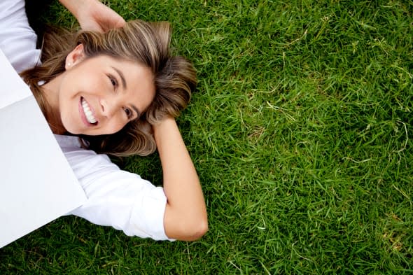 woman relaxing outdoors looking ...