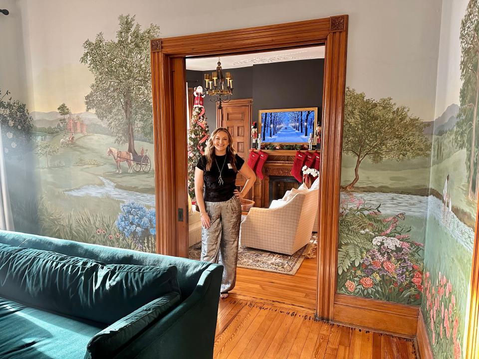 Mara Wilson was commissioned to paint this mural in the Lou-Mar house in Old North Knoxville for the annual Victorian Holiday Home Tour last December. “Especially in a house built in 1889 where my goal was to honor that time,” Wilson said, “I wanted it to feel like the mural has always been there and honor the architect by including the Knox County Courthouse that he designed in the mural.”