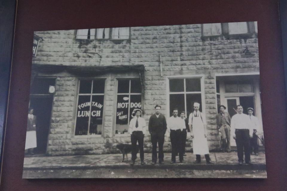 A photo of a restaurant owned by Aimee Aquino's family is hung on the wall of her new eatery Aquino's Deli, Aug. 7, 2023 in Carlsbad.