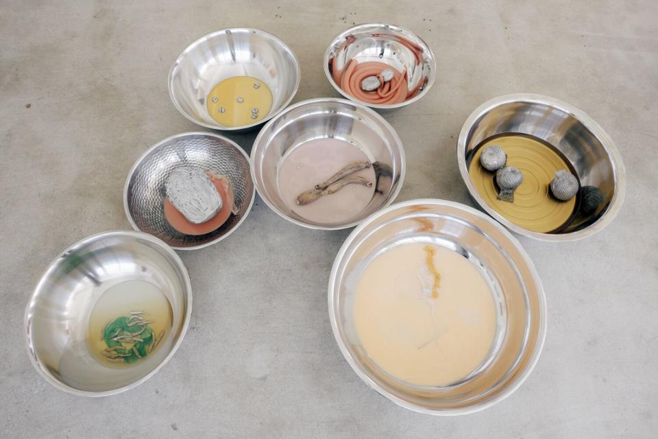 Laurie Kang's art work "Mother," consisting of bowls of simulated foods that are at once appetizing and off-putting.