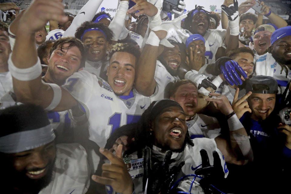 Middle Tennessee players react after winning the Hawaii Bowl NCAA college football game against San Diego State, Saturday, Dec. 24, 2022, in Honolulu. (AP Photo/Marco Garcia)