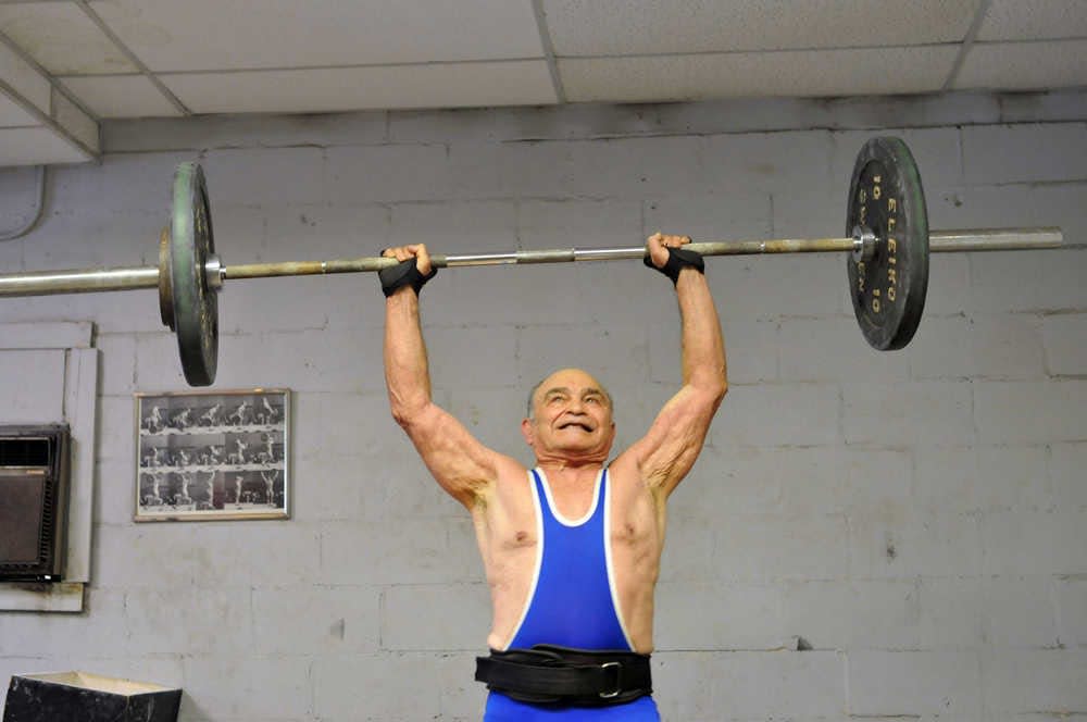 Richard Burkhart/Savannah Morning News
Howard Cohen muscles 132 pounds over his head during a workout at Howard’s Gym in 2012. Still competing as he nears his 80th birthday, Howard is preparing for a competition latter this year.