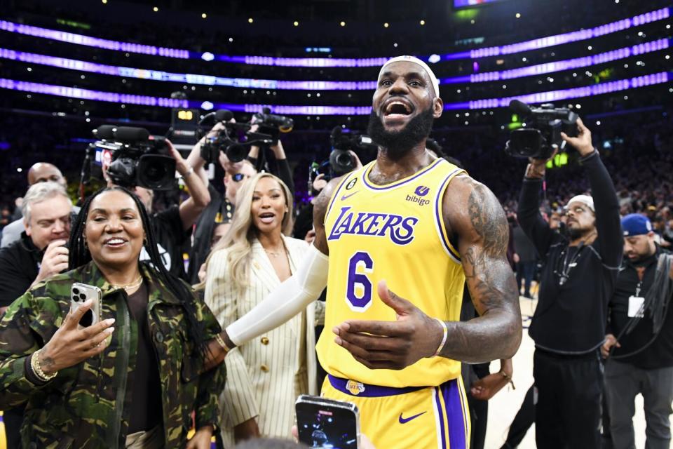 LeBron James celebrates after becoming the all-time NBA scoring leader.