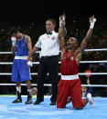 <p>Robson Conceicao of Brazil celebrates after winning his bout against Sofiane Oumiha of France in the men’s light (60kg) final at the Rio Olympics on August 16, 2016. (REUTERS/Peter Cziborra) </p>