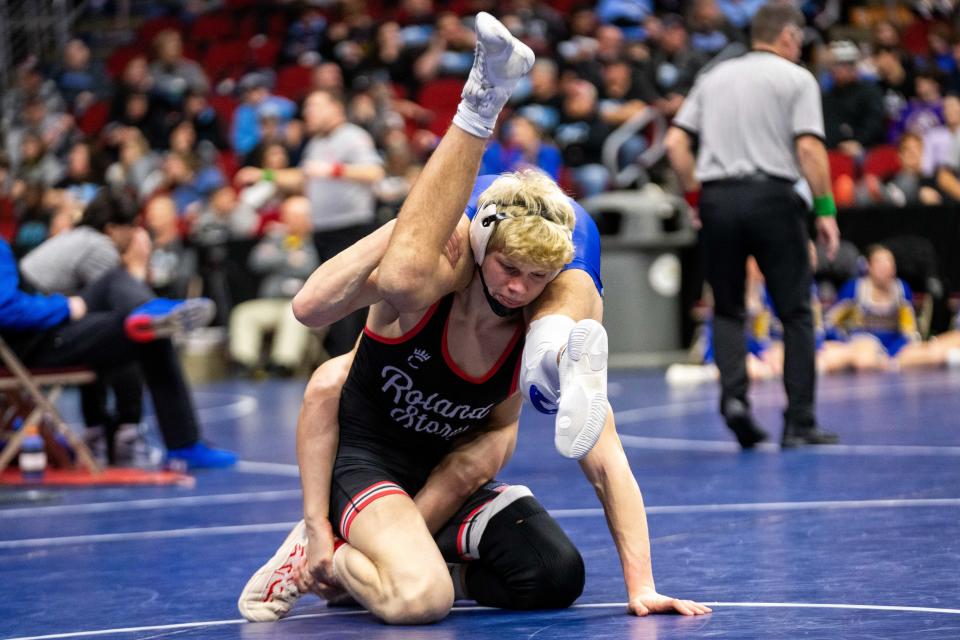 Roland-Story's Logan Powers and Boyden-Hull/Rock Valley's Brock Mulder compete at 165 pounds in 2A during the state wrestling quarterfinals on Thursday, Feb. 15, 2024, at Wells Fargo Arena.