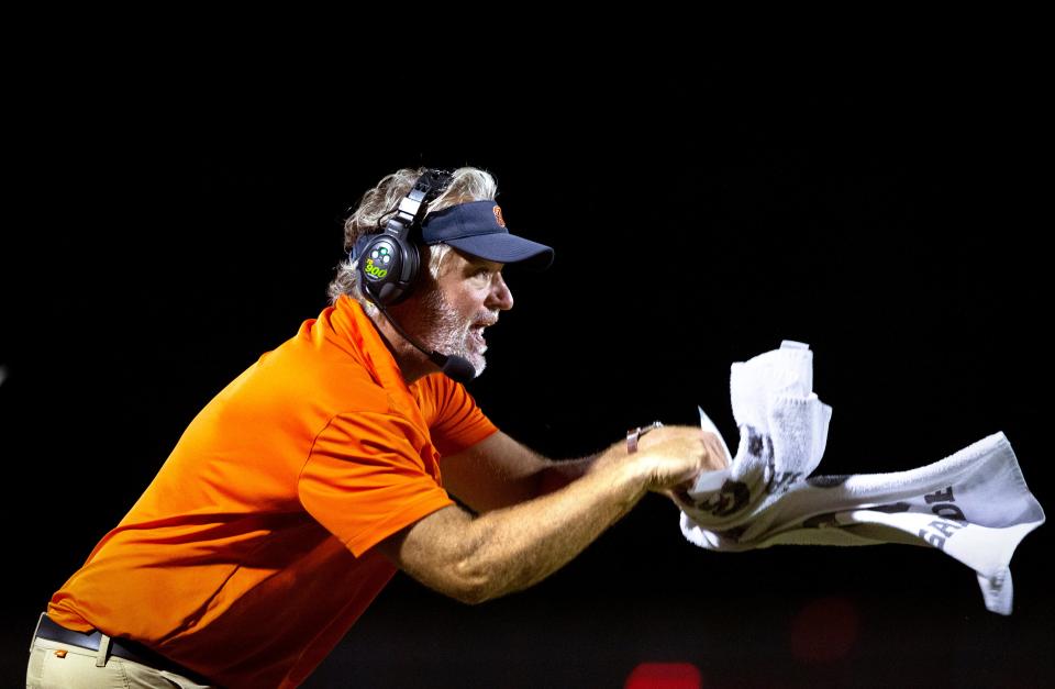 Benjamin head football coach Eric Kresser tells a referee that Palm Beach Central pulled one of his players jersey during their game in Wellington, Florida on October 6, 2023.
